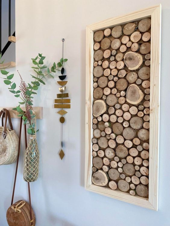 a wood slice wall art in a frame is a great solution for a rustic, farmhouse or Scandinavian interior to try