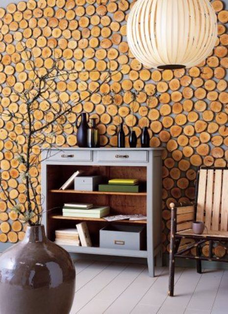 a wood slice accent wall is a stylish and cozy idea for a rustic space, it can make it even cozier and lovelier
