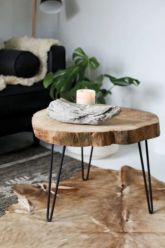 a rustic side table of a tree slice and black hairpin legs is a lovely rustic piece or a plant stand if you need one
