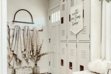 37 a creamy farmhouse space with a series of lockers, a white dresser, pumpkins, greenery and towels is cool