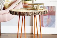 37 a side table of a tree slice and orange hairpin legs is a cool decor piece for a living room in mid-century modern style