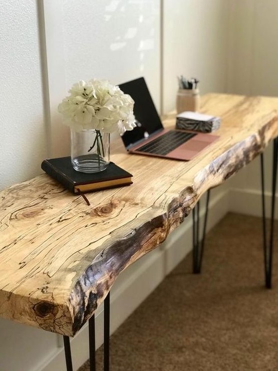 a sleek live edge desk with hairpin legs features two trends in one and can be also used as a console table