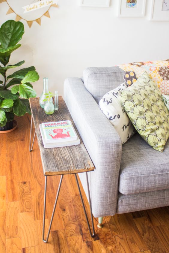 a small console table of a piece of wood and hairpin legs can be easily DIYed to make your living room cooler