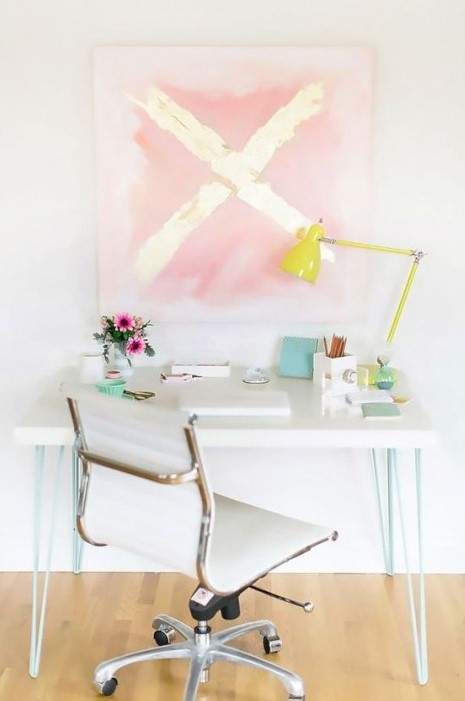 an IKEA Lack coffee table hack into a stylish desk with mint hairpin legs is a perfect fit for a contemporary space