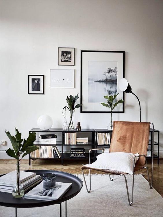 a leather chair with hairpin legs is a great addition to a mid-century modern living room