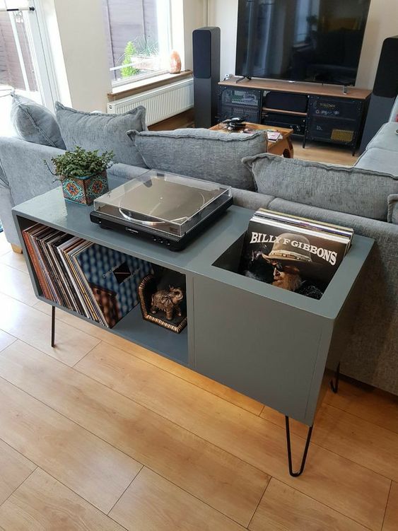 a graphite grey music console with plenty of storage and black hairpin legs is a chic and stylish idea for a living room