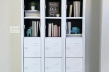 55 white skinny lockers turned into a stylish bookcase, with partly opened compartments and partly closed ones