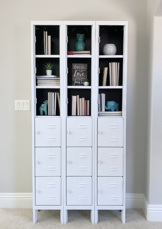 white skinny lockers turned into a stylish bookcase, with partly opened compartments and partly closed ones