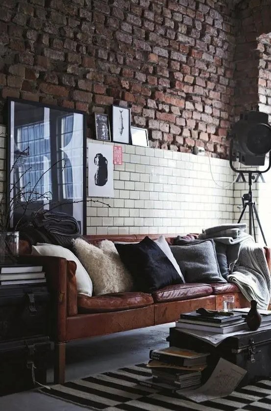 a Stockholm sofa in brown leather looks chic in an industrial space with a vintage feel