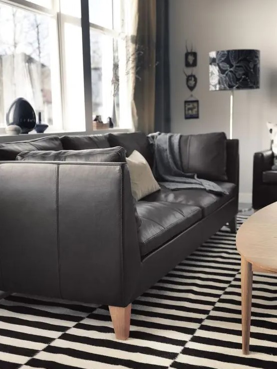 a black leather Stockholm sofa is a gorgeous and timeless idea, an ideal piece for a monochrome space