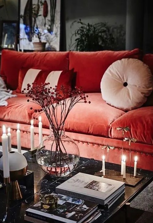 a bold coral velvet sofa will become a centerpiece of your living room thanks to its color and texture