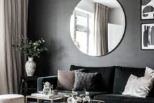 a dramatic living room with a black wall
