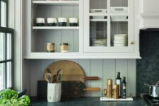 a cute kitchen with a beadboard backsplash