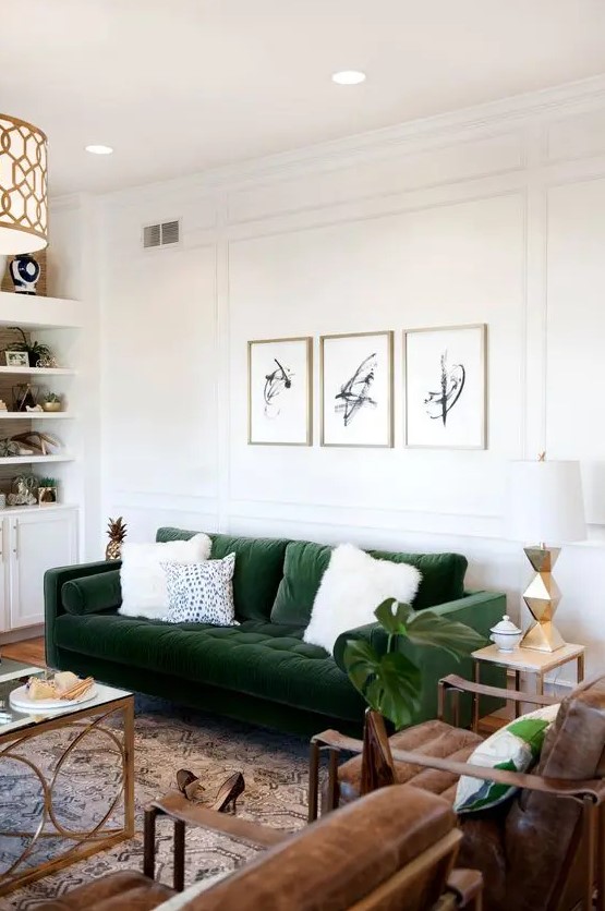 a dark green velvet sofa adds elegance and becomes a focal point in this space and adds color to it at the same time