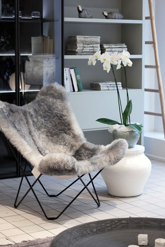 a faux fur butterfly chair is a gorgeous idea for a fall or winter space, it will make you feel cozy and comfy