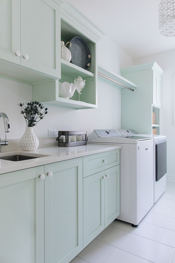 https://www.digsdigs.com/photos/2023/03/a-lovely-mint-green-kitchen-with-shaker-cabinets-and-open-ones-white-stone-countertops-and-white-appliances.jpg