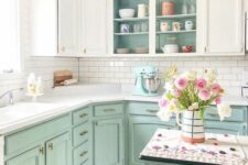 a mint and white kitchen with open cabinets, a white subway tile backsplash, a kitchen island and white countertops