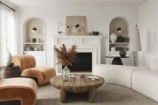 a living room with a trendy curved sofa