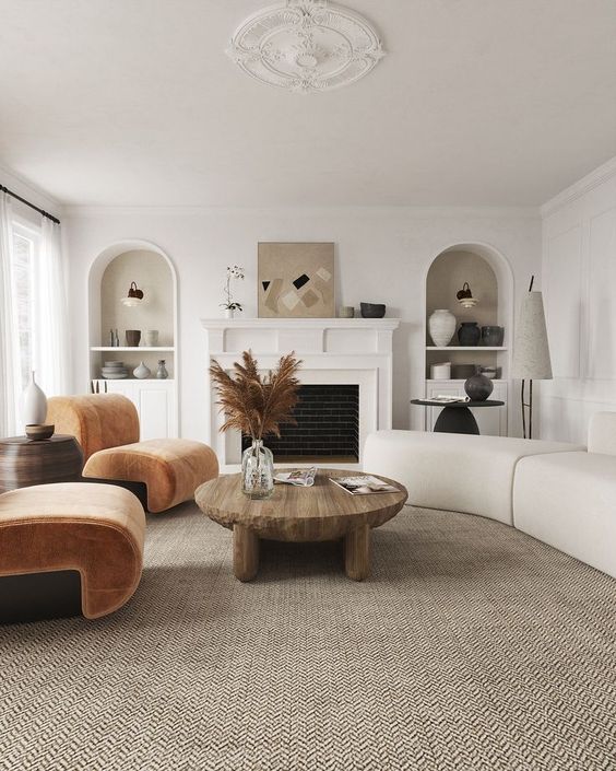a living room with a trendy curved sofa