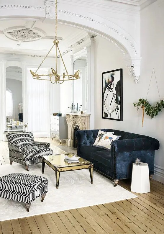 a refined space with shabby touches and a navy velvet Chesterfield sofa as a dark touch