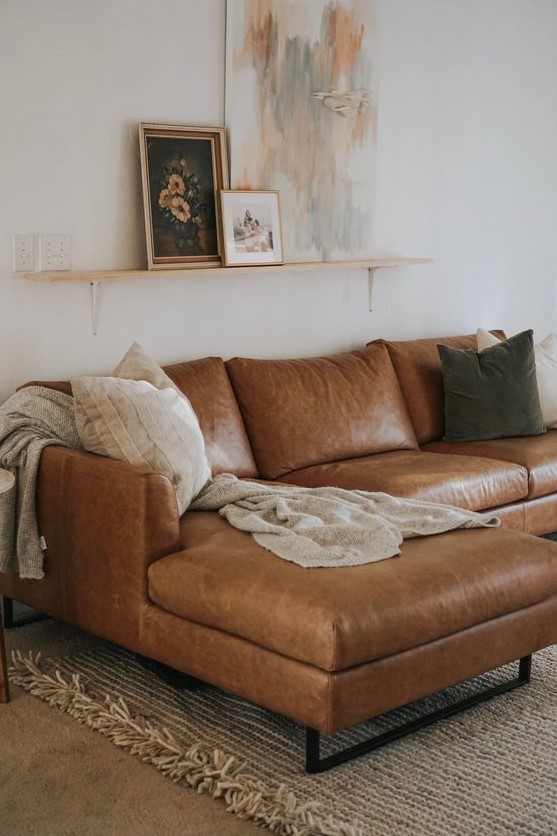 a stylish corner brown leather sofa with various pillows will become a staple of your living room