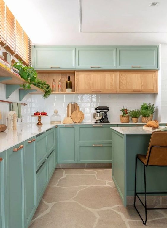 https://www.digsdigs.com/photos/2023/03/a-stylish-mint-kitchen-with-shaker-cabinets-and-a-row-of-stained-ones-a-white-tile-backsplash-and-a-kitchen-island-with-stools.jpg