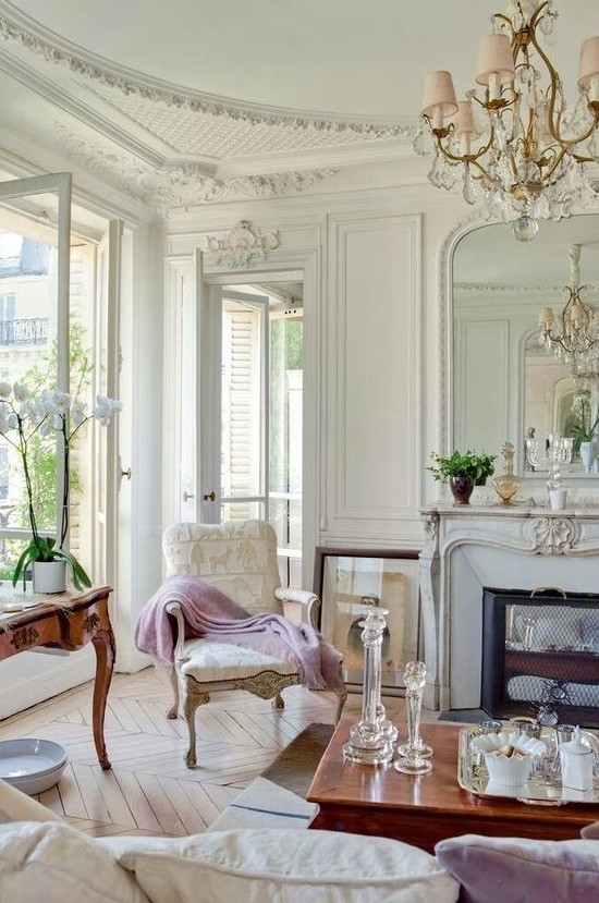a super elegant living room with a Parisian feel and hardwood parquet floors of a neutral warm shade