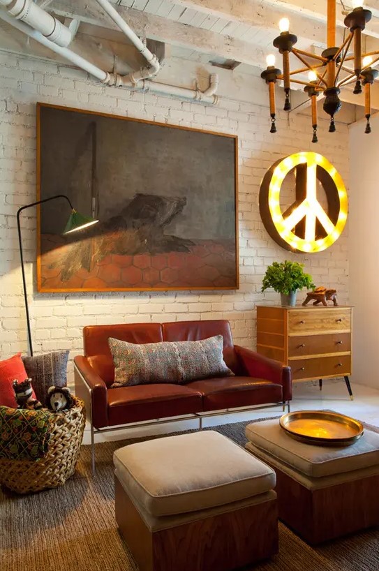 an eclectic living room with industrial touches, mid-century modern furniture and creative artworks