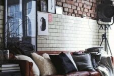 an industrial space with a brown leather Stockholm sofa that brings style and a touch of chic and cool color
