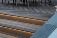 enhanced grain anique oak composite decking, stairs with built-in lights create an elegant and stylish look of the terrace