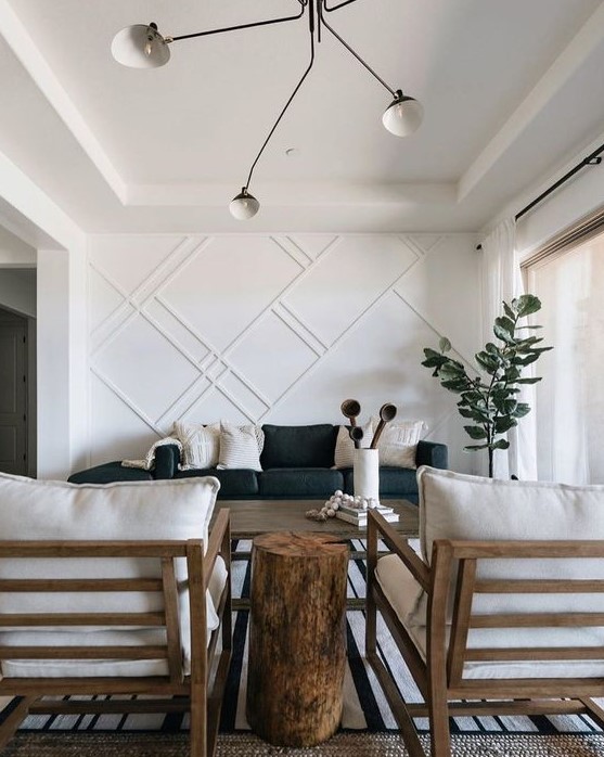 a stylish living room with a white paneled wall that makes an accent and looks bold adding style and chic to the space