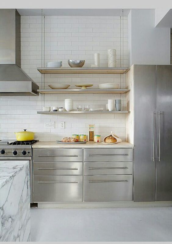 https://www.digsdigs.com/photos/2023/05/03-a-catchy-minimal-kitchen-with-stainless-steel-cabinets-suspended-shelves-a-marble-kitchen-island-and-a-white-tile-backsplash.jpg