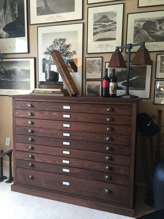 a dark-stained filing cabinet with vintage knobs is a stylish vintage and industrial piece of furniture to rock in your space