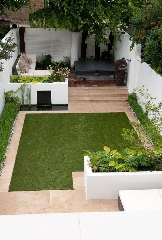 a minimalist townhouse garden with white flower beds with greenery, a tiny pond, a manicured lawn, a sectional sofa and a hot tub a minimalist townhouse garden with white flower beds with greenery, a tiny pond, a manicured lawn, a sectional sofa and a hot tub