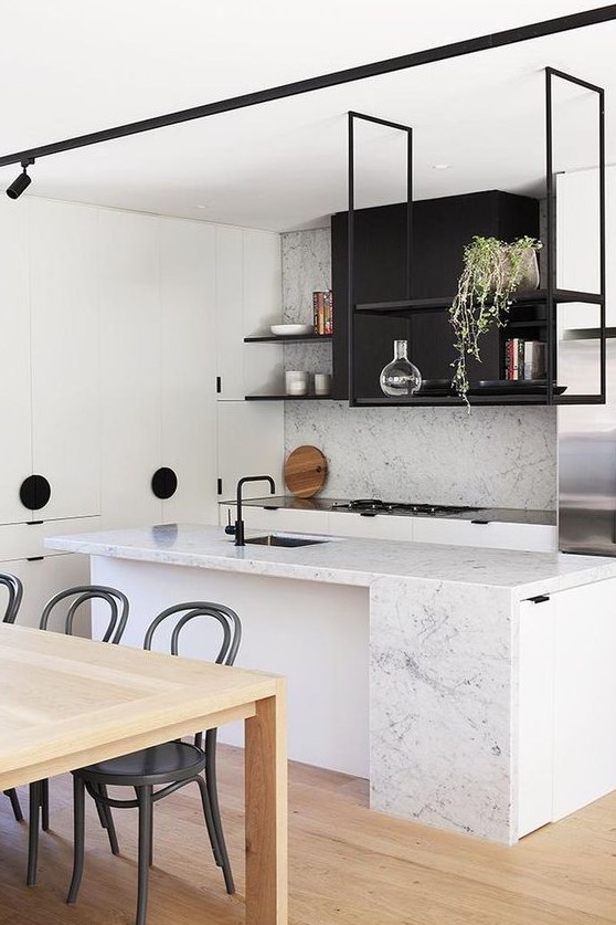 https://www.digsdigs.com/photos/2023/05/11-a-modern-black-and-white-kitchen-with-white-stone-countertops-and-a-backsplash-a-black-suspended-shelf-and-potted-greenery.jpg