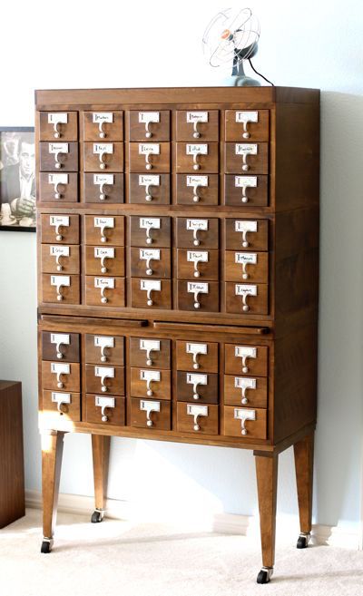 a vintage stained card catalogue on casters is a cool addition to a home office, it looks stylish and adds charm to the space