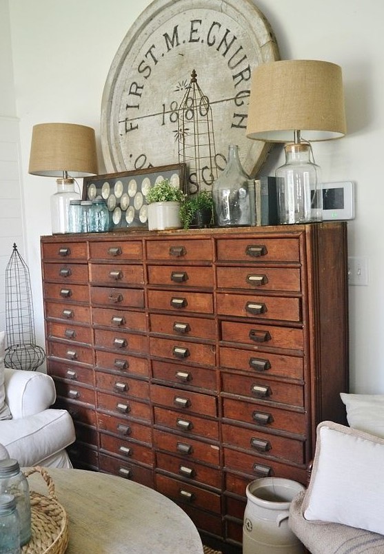 a vintage stained file cabinet with table lamps, greenery, decor is a perfect solution for shabby chic and vintage spaces