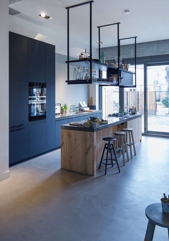 a contemporary black kitchen with sleek cabinets, a stained kitchen island and a suspended black shelf plus black stools
