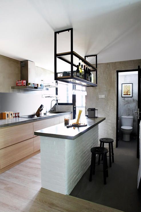 a contemporary meets minimalist kitchen with stained cabinets, a tiled kitchen island, a suspended shelf over it