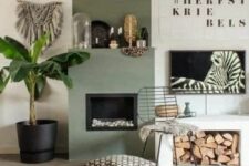 32 a cool boho nook with an olive green fireplace, a bench with firewood storage, some art and a potted plant