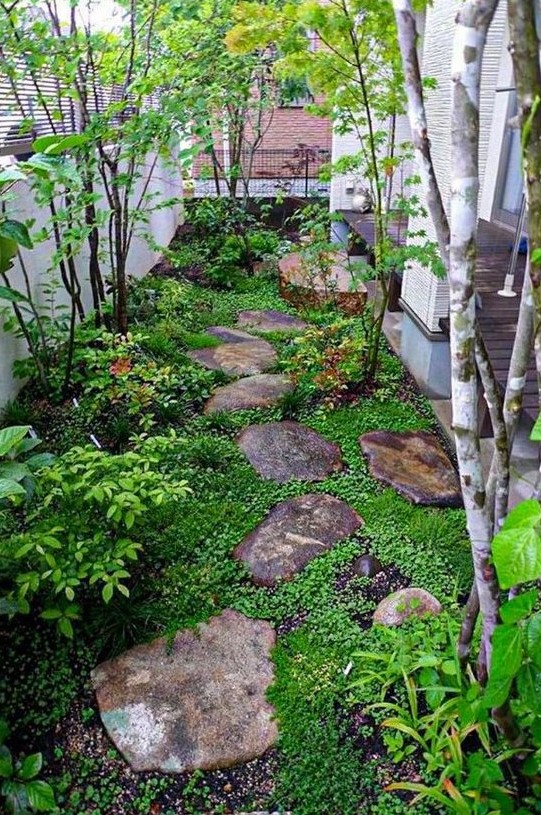 a small Japanese inspired garden with rocks as pavements, greenery, shrubs and a couple of trees is very peaceful a small Japanese-inspired garden with rocks as pavements, greenery, shrubs and a couple of trees is very peaceful