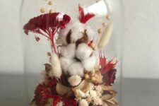 a bold fall flower dome with cotton, burgundy blooms and white dried ones and berries and grasses is very cool
