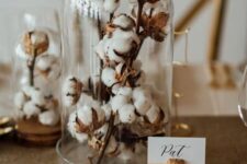 a couple of cloches with cotton branches are a cool and lovely decoration or a centerpiece for any home, they look very cozy and lovely