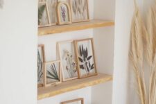 a lovely niche with shelves used as picture ledges