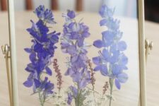beautiful purple pressed flowers in a gilded frame will be a nice decoration for any space, place it on the table or mantel