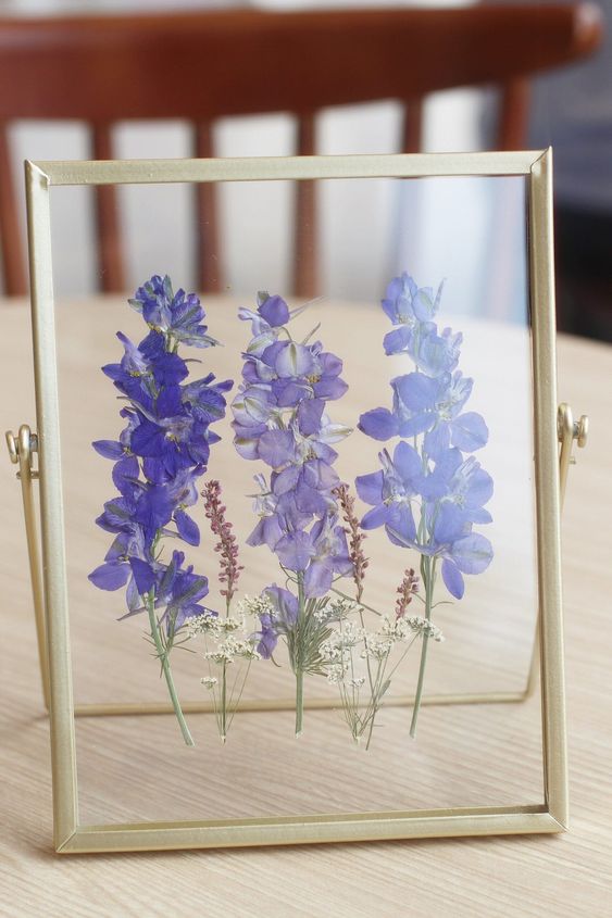 beautiful purple pressed flowers in a gilded frame will be a nice decoration for any space, place it on the table or mantel