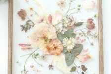 pressed neutral and pastel blooms and leaves in a light-stained frame are a nice idea for a boho space