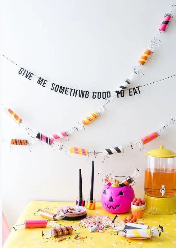 colorize your Halloween party with a colorful toilet paper roll and bright pumpkins