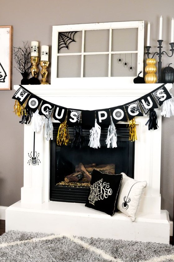a glam Halloween mantel with gilded pumpkins, candleholders, black pumpkins, spiders and bright tassels