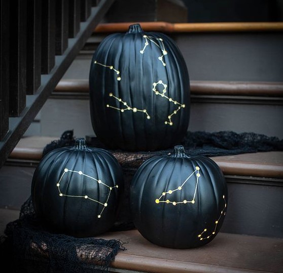 an arrangement of dark green constellation luminaries is a great idea not only for Halloween but also for the fall